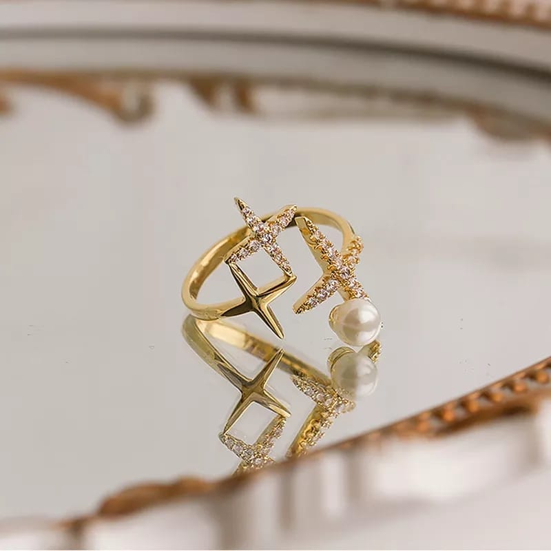 Elegant Gold Ring with Diamond Accents and Pearl